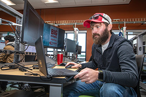 IT Student working at computer workstation