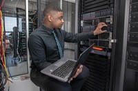 IT Student working at a server