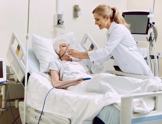 Respiratory therapist assisting patient