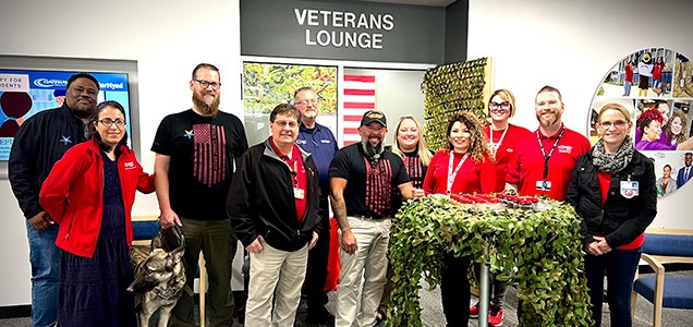 Staff in front of Veterans Lounge