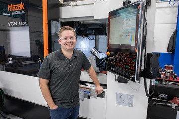 Kent Schopp in front of CNC equipment