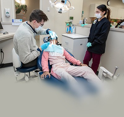 Dental Hygienist student performing cleaning under supervision